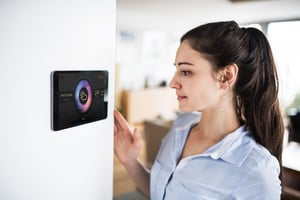 woman interacting with crank storyboard UI thermostat with voice